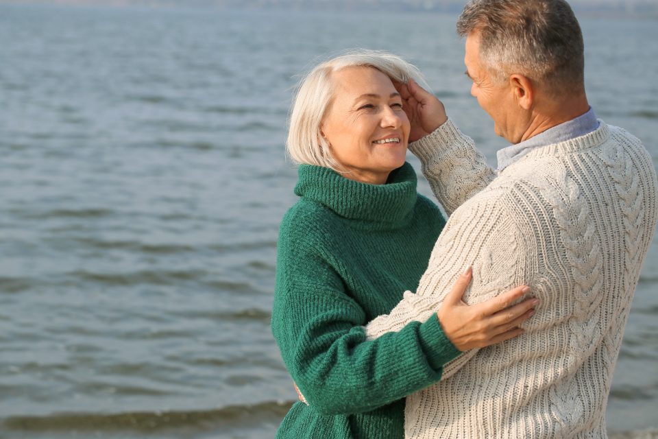 Older couple embracing at home