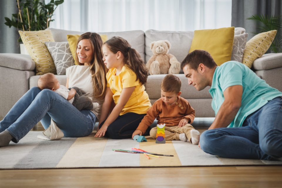 Young family playing together at home