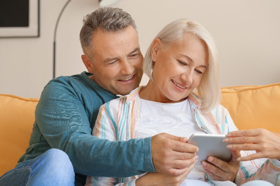Couple reviewing insurance options together at home