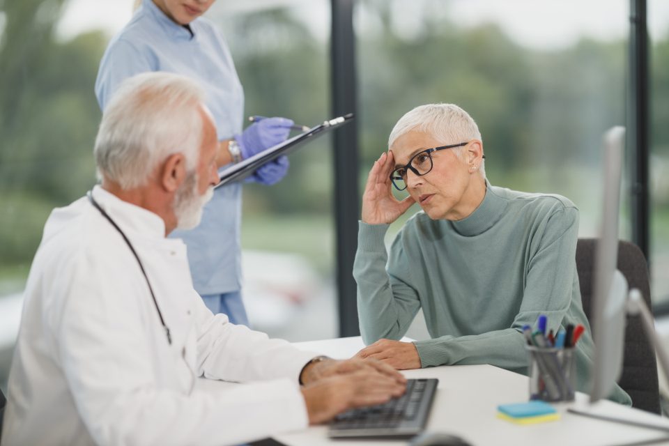 Doctor talking with an older patient