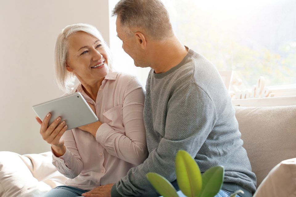 Couple reviewing Medicare plan options together on a tablet