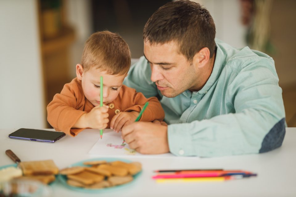 Father helping his son with homework